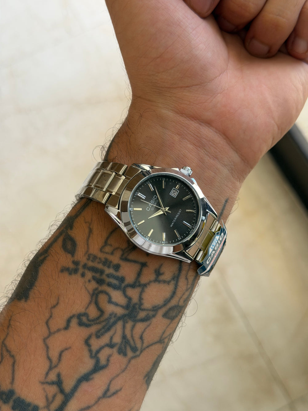 Casio rond argent noir