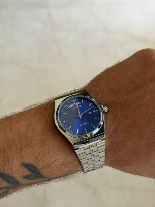 casio day date mtp b146 argent bleu