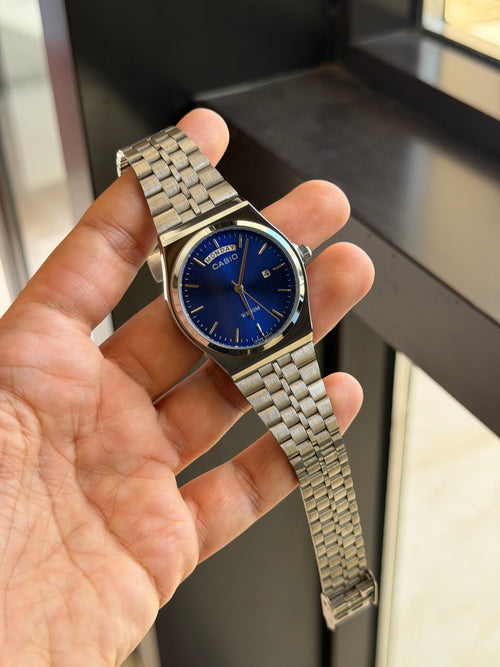 casio day date mtp b146 argent bleu