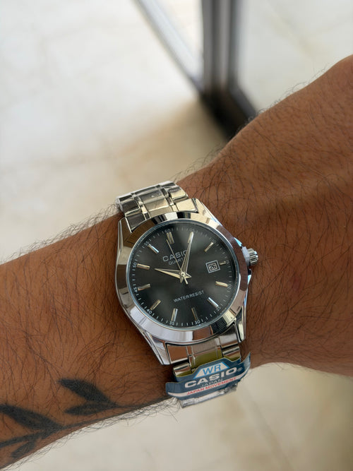Casio rond argent noir