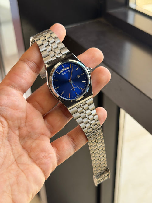 casio day date mtp b146 argent bleu