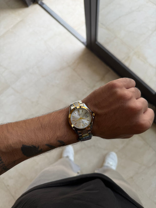 Casio rond blanc avec ceinture gris dore